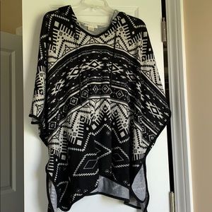 Soft poncho with a hood.